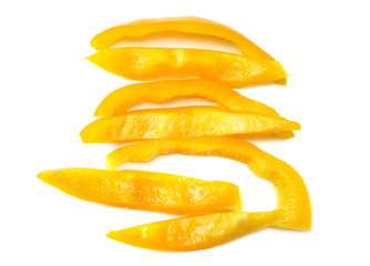 Fototapeta na wymiar cut slices of yellow sweet bell pepper isolated on white background top view