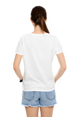 Fototapeta premium Young woman in t-shirt on white background. Mock up for design