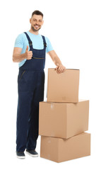 Portrait of moving service employee with cardboard boxes on white background
