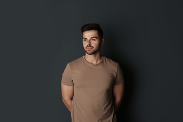 Fototapeta premium Portrait of handsome man on dark background