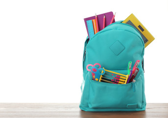 Fototapeta Bright backpack with school stationery on white background obraz