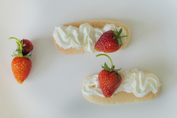 Biscuits with Cream and Strawberries isolated on a White Background