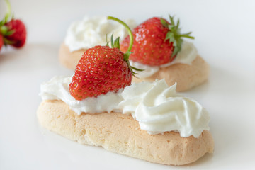 Biscuits with Cream and Strawberries isolated on a White Background
