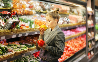 Woman buying vegetables at the market