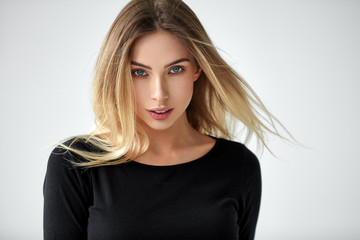 Portrait of beautiful blonde woman isolated on white background
