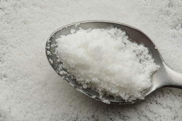 Salt in metal spoon