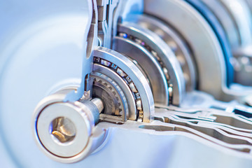 Bearings and gears on the shaft. Mechanics. Mechanical engineering. Box of the car transmission in...