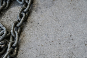 Chain on Textured Cement