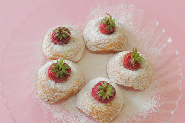 Mini Cakes with Strawberries isolated on a Pink Background
