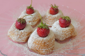 Mini Cakes with Strawberries isolated on a Pink Background