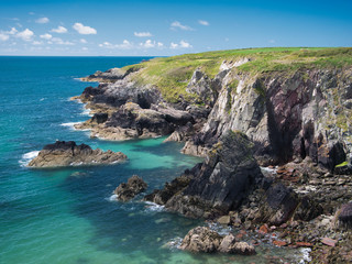 Fototapeta na wymiar Coastal cliffs in Pembrokeshire, South Wales, UK, as viewed from the Coast Path