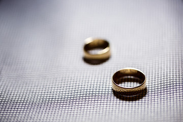 Golden wedding rings for newlyweds on their wedding day