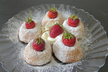 Mini Cakes with Strawberries isolated on a Black Background