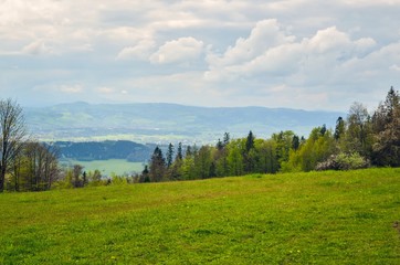 Beautiful spring mountain landscape. Green rural scenery on the hills. © shadowmoon30