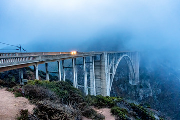 Fototapeta na wymiar Fog Covered Bridge over Canyon 