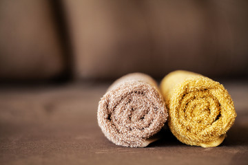 Chocolate Spa . Composition brown towel in hotel room of spa treatment