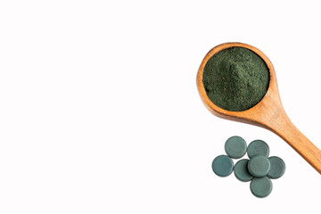 spirulina powder and spirulina pills - healthy superfood diet and detox nutrition concept - Text space