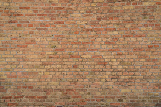 Fototapeta Real vintage Bumpy, rough and old brick texture with imperfect, dilapidate, impair , corroded and defective defective english brick bond pattern.