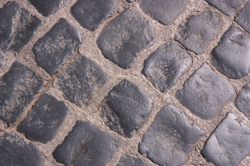 Close-up of a cobblestone floor of a street in a village