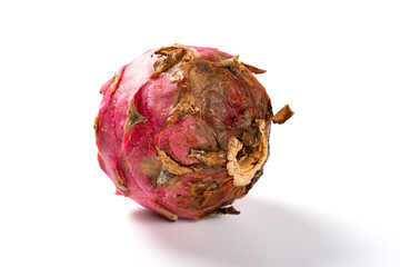 overripe dragon fruit on a white background