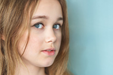 Obraz premium Portrait of beautiful young woman with brown hair. Closeup face of a pretty caucasian model looking at camera.