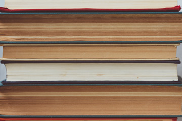 Stack of multicolored books closeup, education, reading, back to school concept,