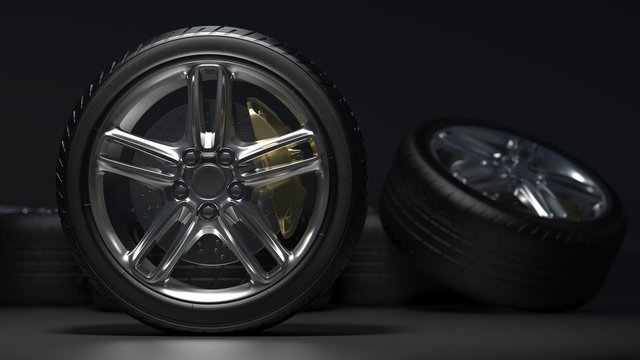  tire auto on a dark background. Alloy wheels.  3d render