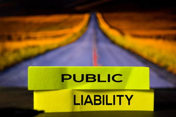 Public Liability on the sticky notes with bokeh background
