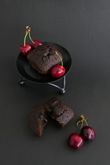 Juicy Brownies with Cherries isolated on a Black Background