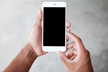 Cropped shot view of man hands holding smart phone with blank copy space screen for your text message or information content, female reading text message on cell telephone during in urban setting. 