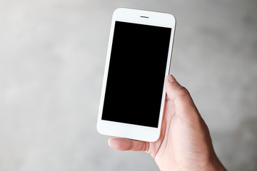 Cropped shot view of man hands holding smart phone with blank copy space screen for your text message or information content, female reading text message on cell telephone during in urban setting. 