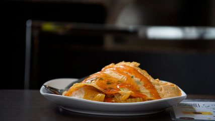 Dish of fried egg with chili sauce