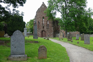The cemetery and ruins of Beauly Priory, built in the 1200s AD and located in Inverness-shire, Scotland, are shown during an afternoon day.