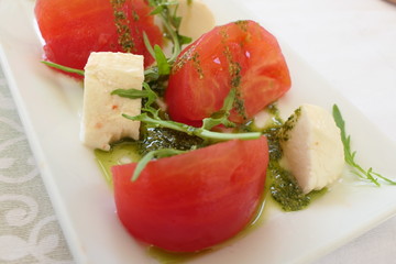 Traditional Italian Salad with Tomatoes, Mozarella and Pesto