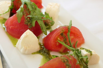 Traditional Italian Salad with Tomatoes, Mozarella and Pesto