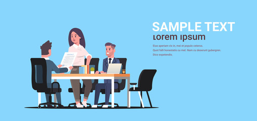 businesspeople discussing contract during business development meeting colleagues partners working with co-investment document negotiation concept flat horizontal copy space full length