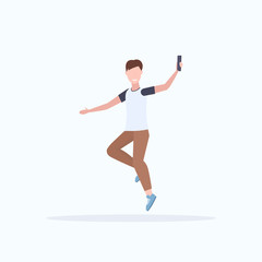 Fototapeta na wymiar man taking selfie photo on smartphone camera casual male cartoon character jumping posing white background flat full length