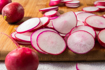 Radish Sliced on a Wooden Chopping Board Close Up