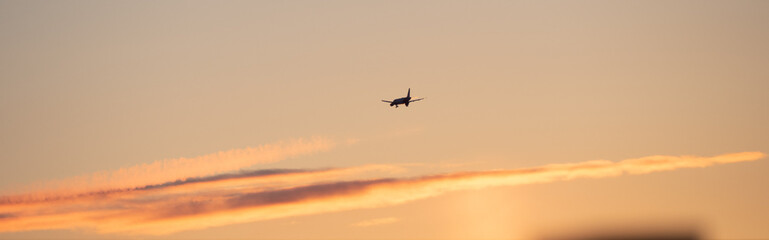 Fototapeta na wymiar Plane at Sunset