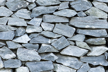 Stone wall background close up. Rock texture background.