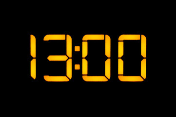 Electronic digital clock with yellow numbers on a black background shows the time Thirteen zero...