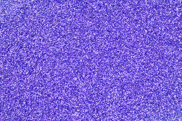 Violet decorative sequins. Background image with shiny bokeh lights from small elements