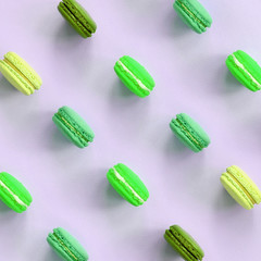 Dessert cake macaron or macaroon on trendy pastel lilac background top view