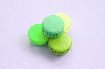 Dessert cake macaron or macaroon on trendy pastel lilac background