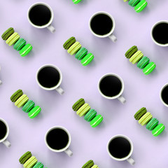 A pattern of many colorful dessert cake macaroon and coffee cups on trendy pastel lilac background top view