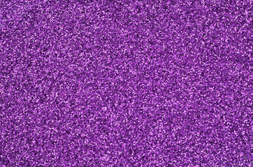 Purple decorative sequins. Background image with shiny bokeh lights from small elements