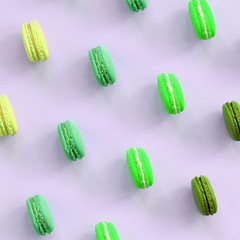 Dessert cake macaron or macaroon on trendy pastel lilac background top view