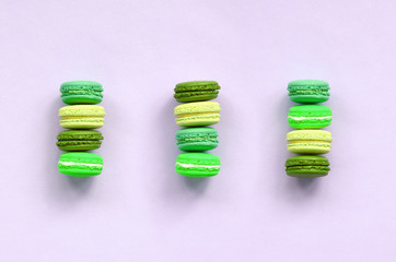 Dessert cake macaron or macaroon on trendy pastel lilac background top view
