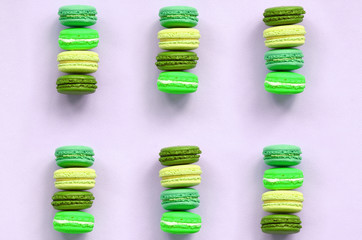 Dessert cake macaron or macaroon on trendy pastel lilac background top view