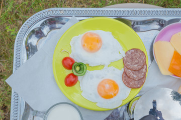 City Amatciems, Latvian republic. Morning breakfast outside. Fried egg, cheese and bread. Travel photo 14. Jun. 2019